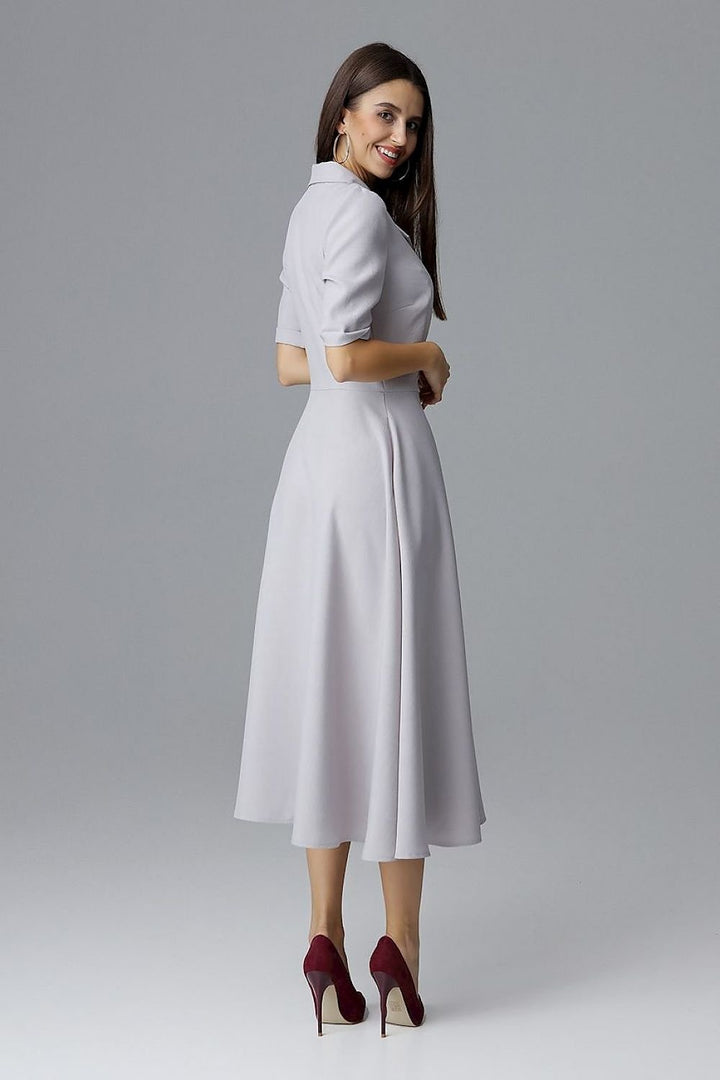 A 7/8-length double-breasted Daydress  Figl